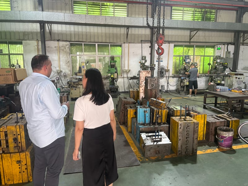 Tooling and mold shop, team reviewing steel molds